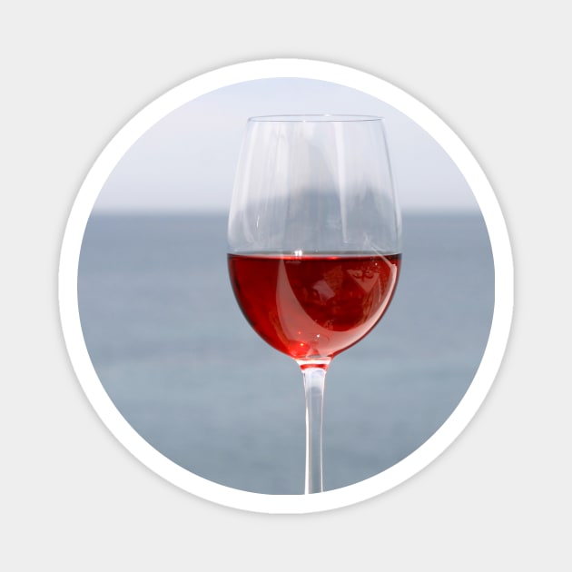 Glass of wine with sea in background Magnet by Melissa Peltenburg Travel Photography